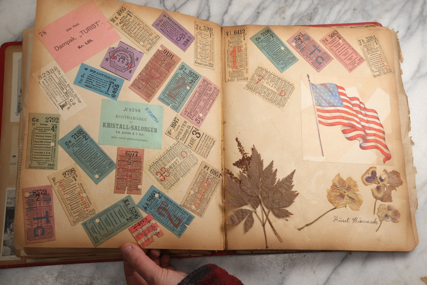 Lot 079 - Antique Red Scrapbook Album With Silver Painted Embossed Decorations, Hamburg, Stockholm, Paris, England, Stratford-On-Avon, Scotland, Liverpool Ephemera, Two Full Spreads Homemade Herbarium, Circa 1896