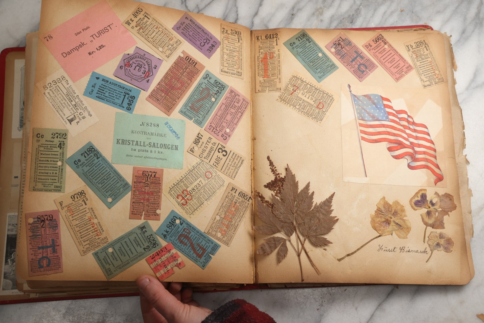 Lot 079 - Antique Red Scrapbook Album With Silver Painted Embossed Decorations, Hamburg, Stockholm, Paris, England, Stratford-On-Avon, Scotland, Liverpool Ephemera, Two Full Spreads Homemade Herbarium, Circa 1896