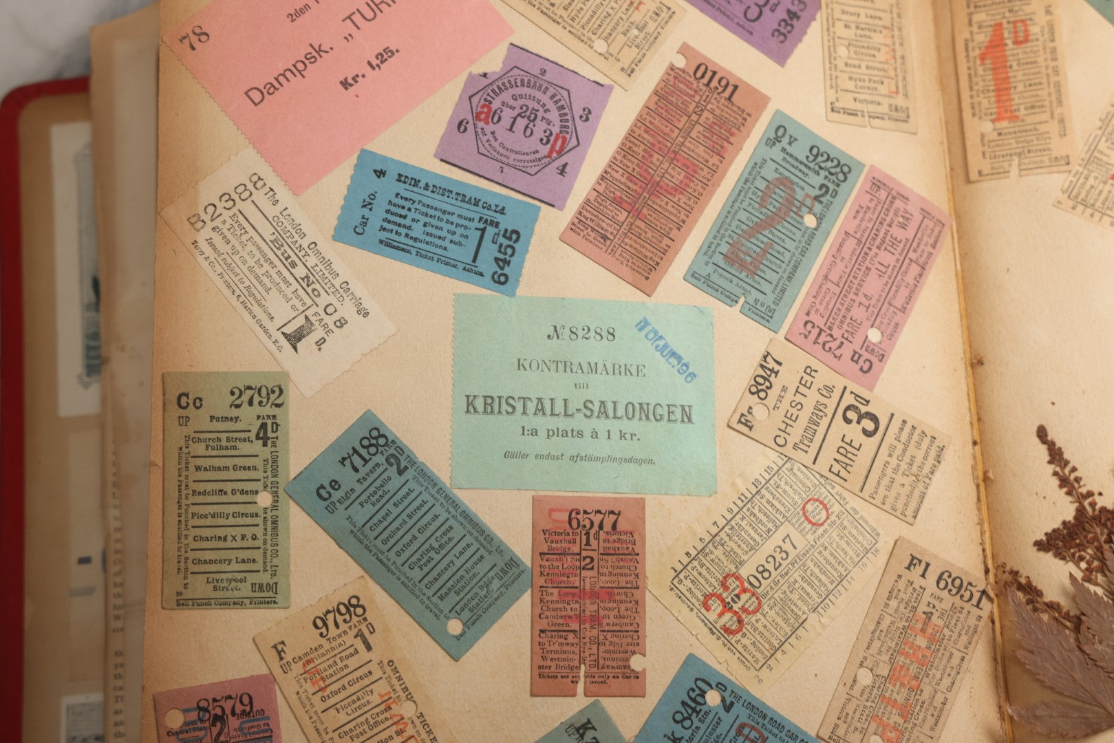 Lot 079 - Antique Red Scrapbook Album With Silver Painted Embossed Decorations, Hamburg, Stockholm, Paris, England, Stratford-On-Avon, Scotland, Liverpool Ephemera, Two Full Spreads Homemade Herbarium, Circa 1896