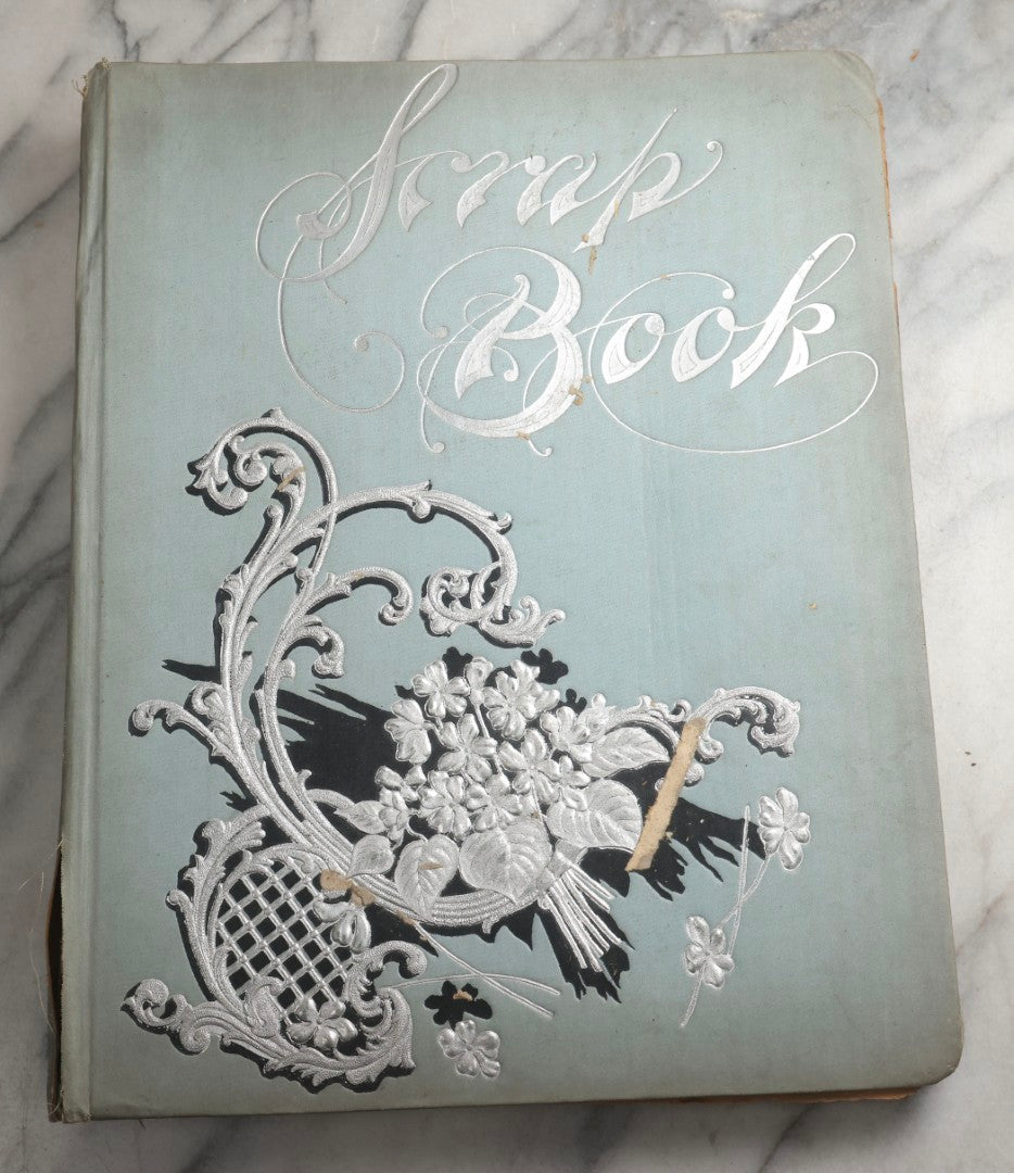 Lot 080 - Antique Light Blue Scrapbook Album With Silver Painted Embossed Decorations, California, San Francisco Chinatown, Oakland, Yosemite Ephemera, Homemade Herbarium With Location Captions Including Yellowstone Park And Utah, Circa 1897