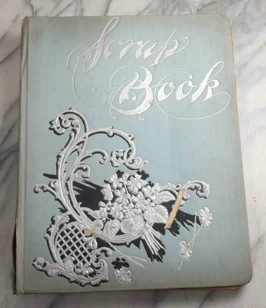 Lot 080 - Antique Light Blue Scrapbook Album With Silver Painted Embossed Decorations, California, San Francisco Chinatown, Oakland, Yosemite Ephemera, Homemade Herbarium With Location Captions Including Yellowstone Park And Utah, Circa 1897