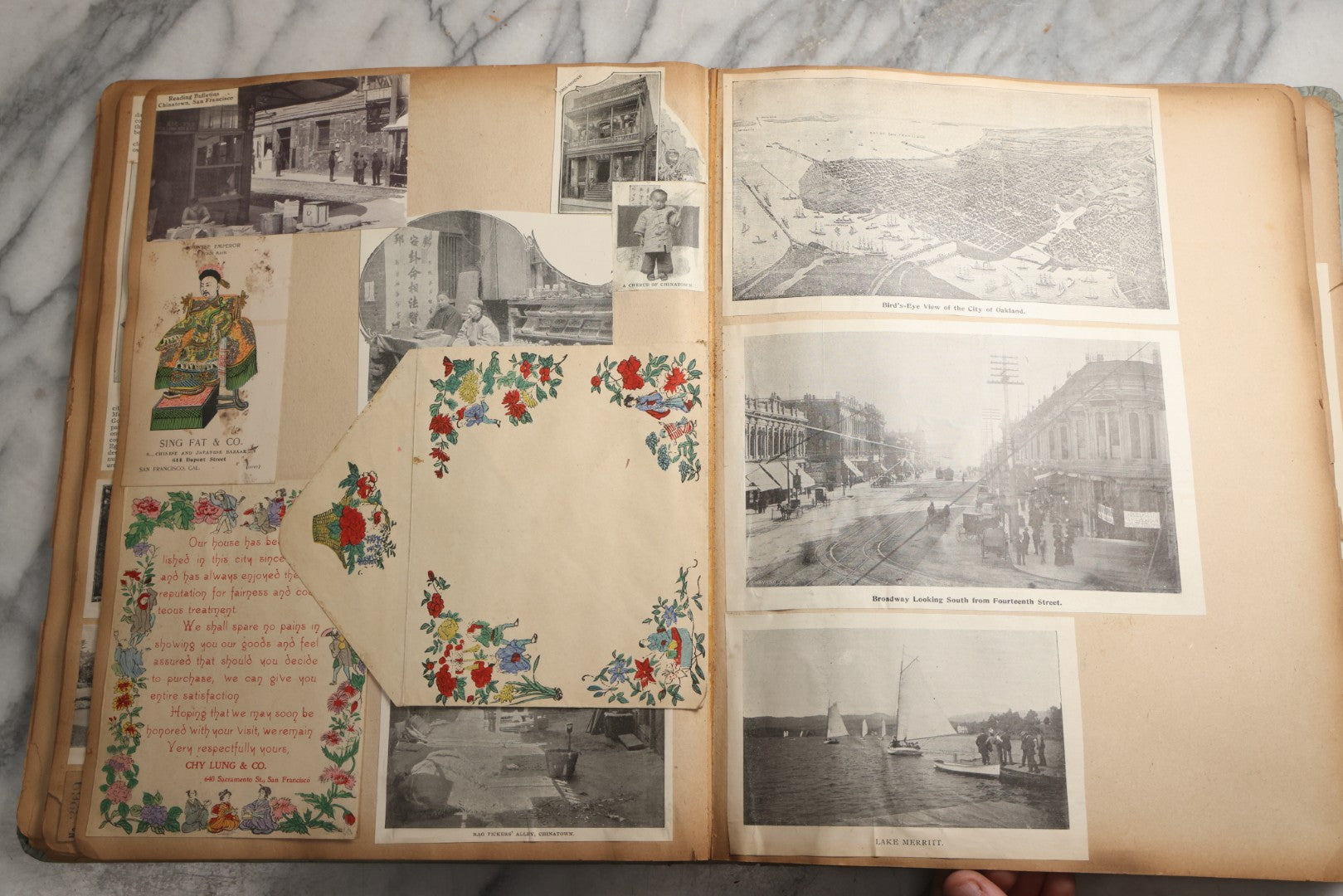 Lot 080 - Antique Light Blue Scrapbook Album With Silver Painted Embossed Decorations, California, San Francisco Chinatown, Oakland, Yosemite Ephemera, Homemade Herbarium With Location Captions Including Yellowstone Park And Utah, Circa 1897