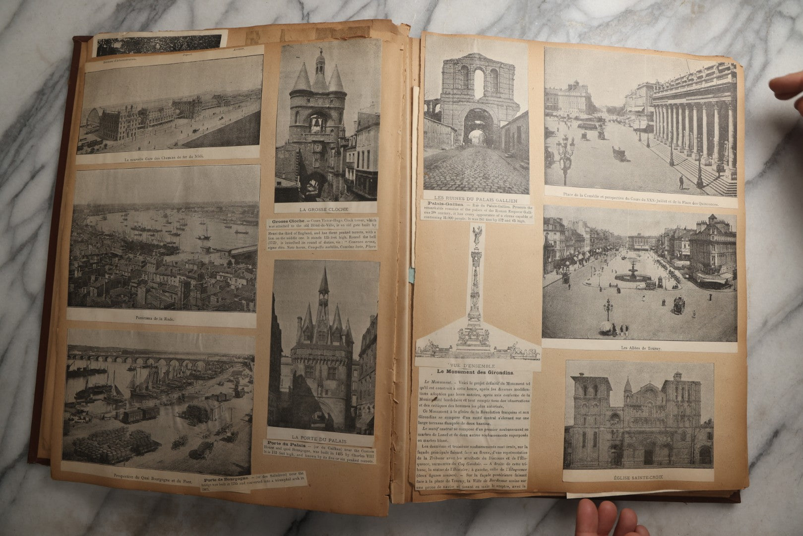 Lot 082 - Antique Brown Scrapbook Album With Gold Borders, European Travel Ephemera Including Touraine, Northern Spain, Holland, Wales, Thomas Cook Tickets, Hotel Menus, Postcards, Pressed Flowers, Circa 1901