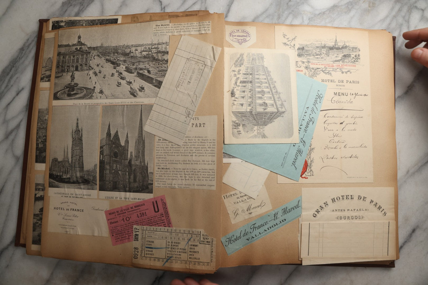 Lot 082 - Antique Brown Scrapbook Album With Gold Borders, European Travel Ephemera Including Touraine, Northern Spain, Holland, Wales, Thomas Cook Tickets, Hotel Menus, Postcards, Pressed Flowers, Circa 1901