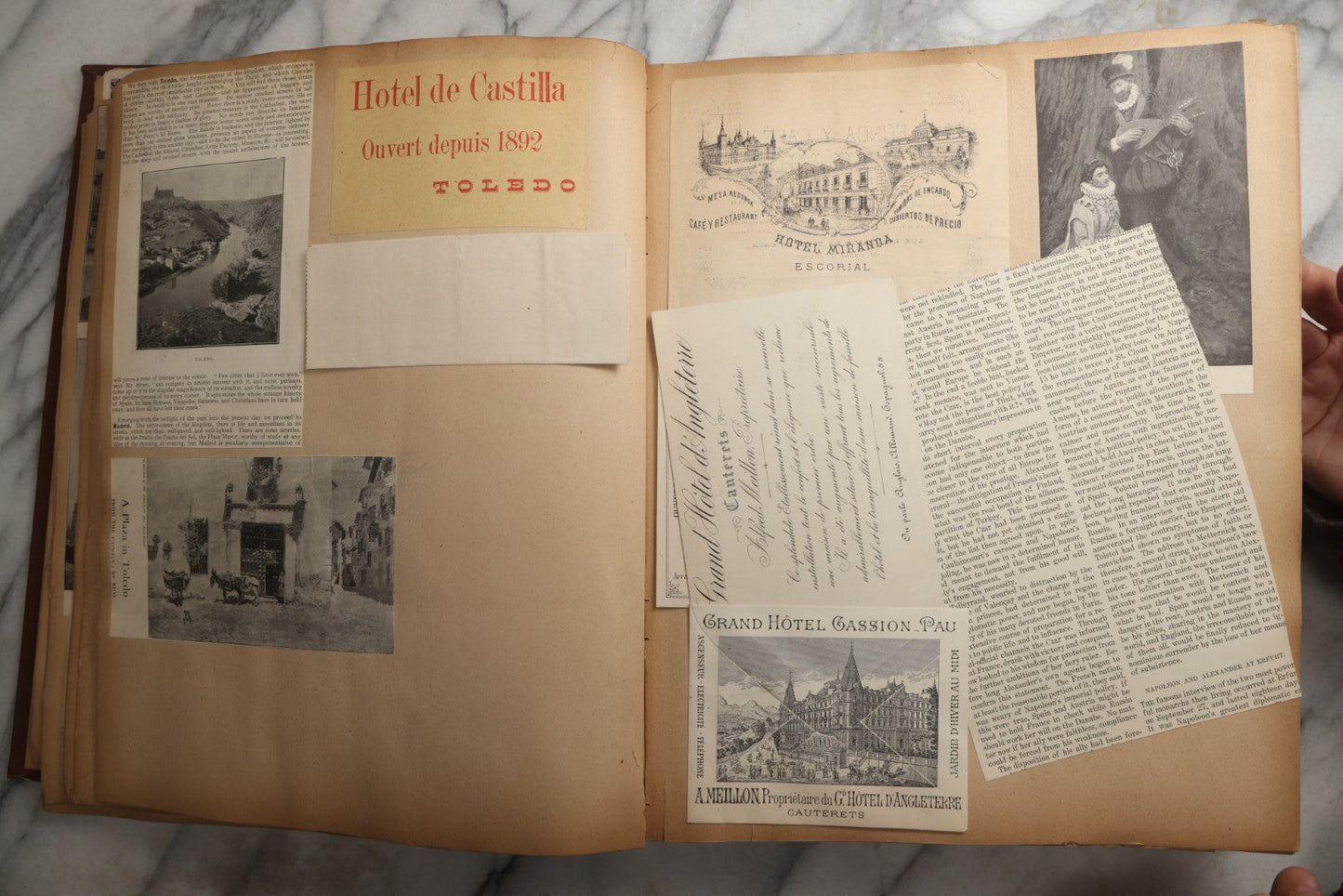 Lot 082 - Antique Brown Scrapbook Album With Gold Borders, European Travel Ephemera Including Touraine, Northern Spain, Holland, Wales, Thomas Cook Tickets, Hotel Menus, Postcards, Pressed Flowers, Circa 1901
