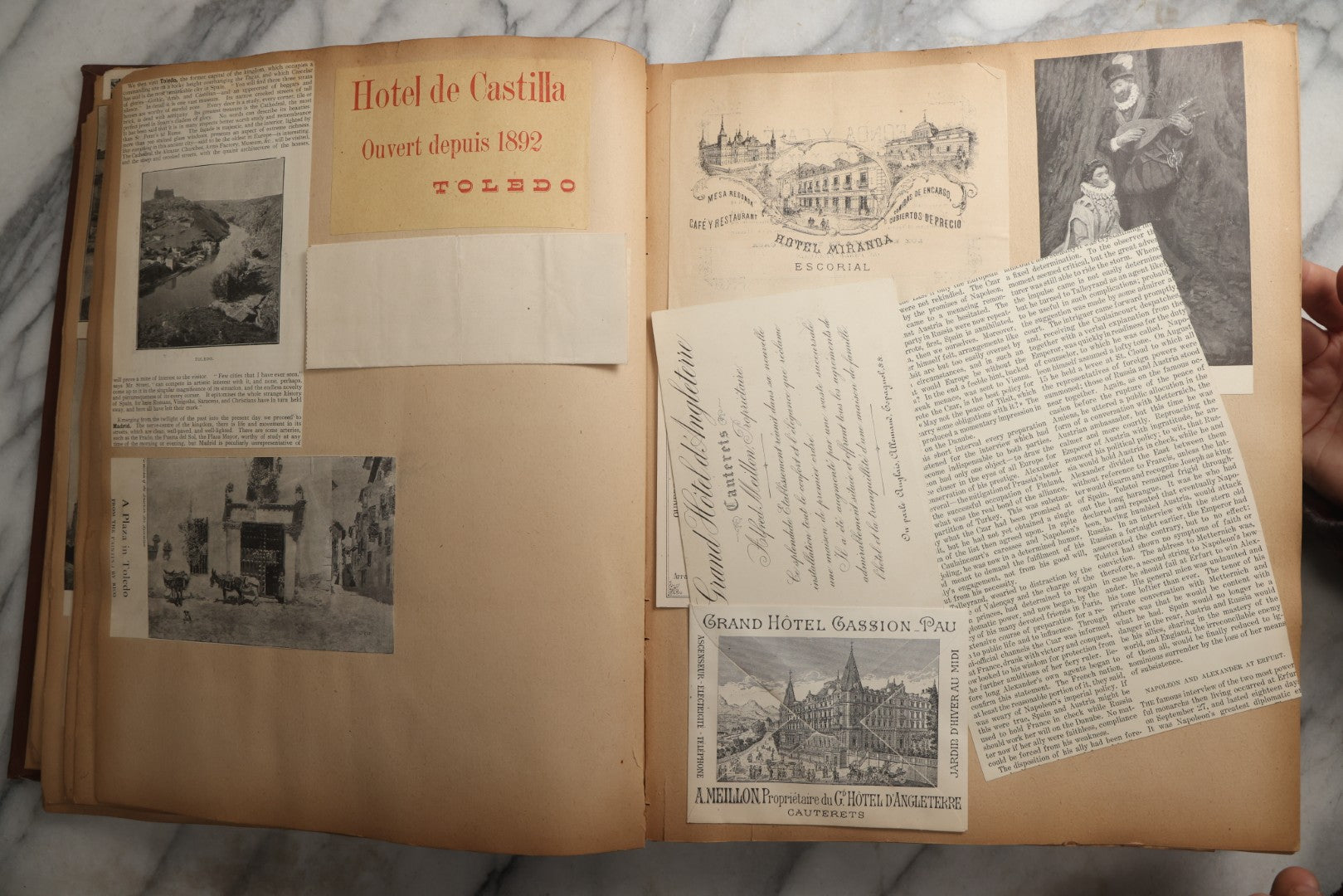 Lot 082 - Antique Brown Scrapbook Album With Gold Borders, European Travel Ephemera Including Touraine, Northern Spain, Holland, Wales, Thomas Cook Tickets, Hotel Menus, Postcards, Pressed Flowers, Circa 1901