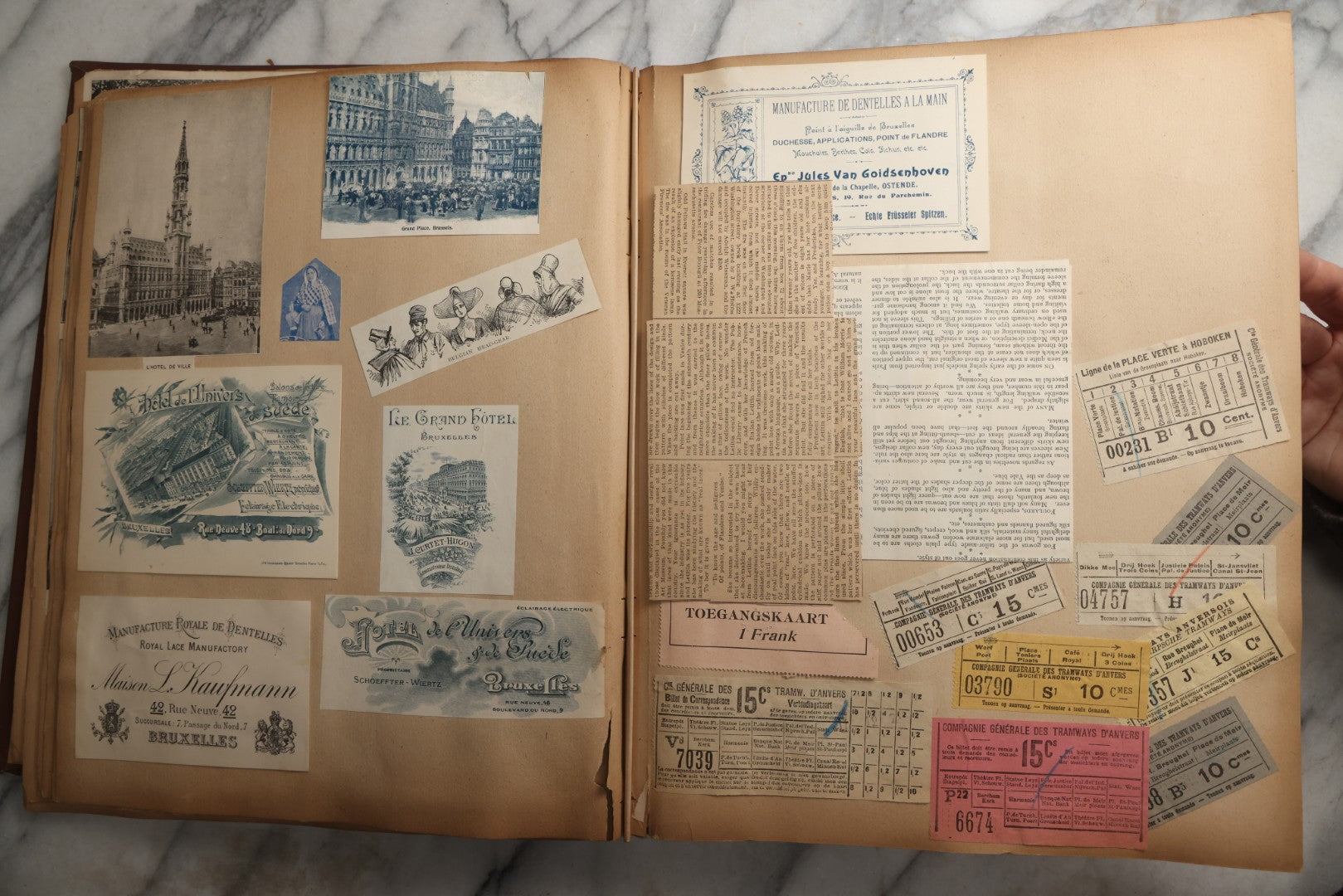 Lot 082 - Antique Brown Scrapbook Album With Gold Borders, European Travel Ephemera Including Touraine, Northern Spain, Holland, Wales, Thomas Cook Tickets, Hotel Menus, Postcards, Pressed Flowers, Circa 1901