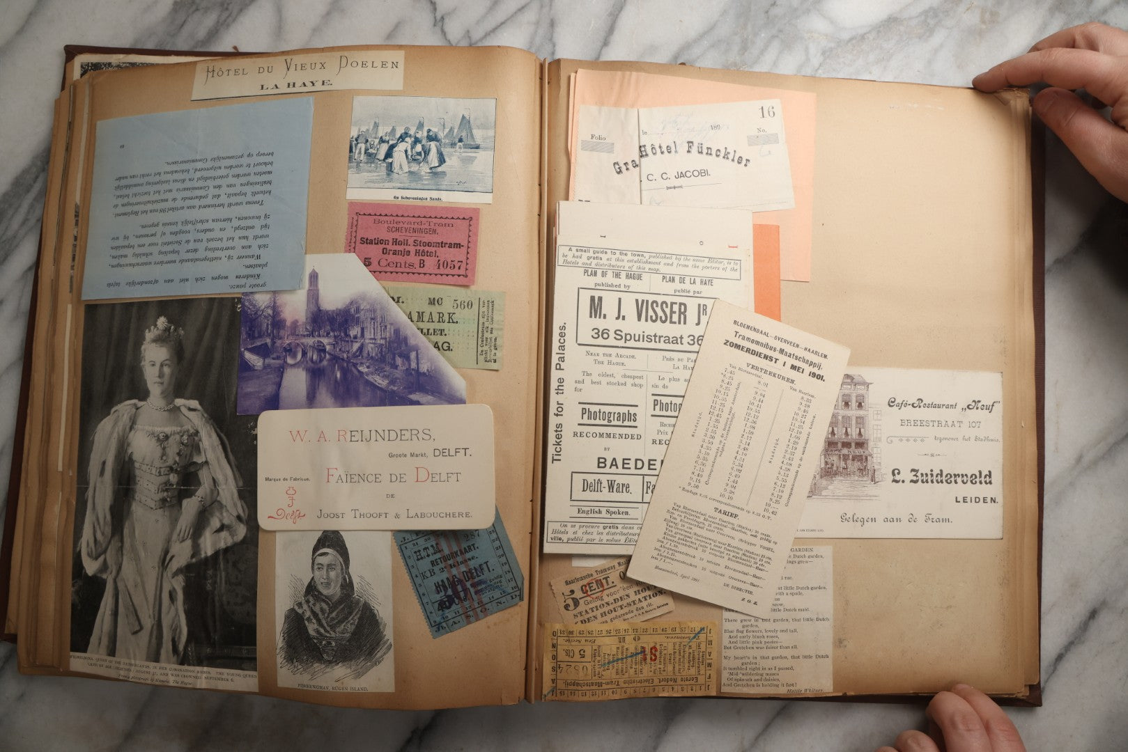 Lot 082 - Antique Brown Scrapbook Album With Gold Borders, European Travel Ephemera Including Touraine, Northern Spain, Holland, Wales, Thomas Cook Tickets, Hotel Menus, Postcards, Pressed Flowers, Circa 1901