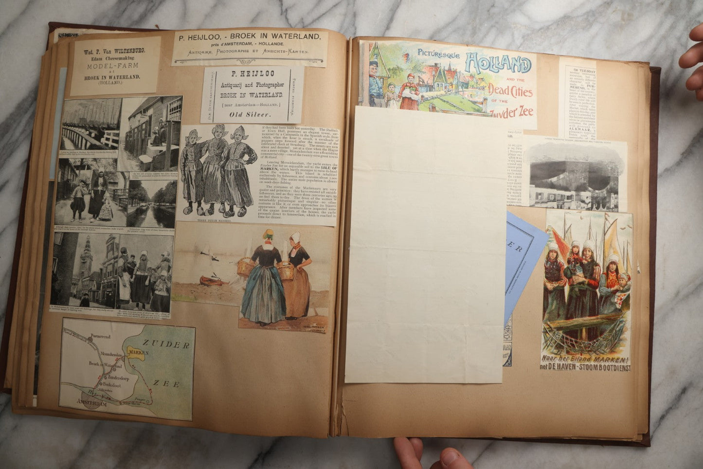 Lot 082 - Antique Brown Scrapbook Album With Gold Borders, European Travel Ephemera Including Touraine, Northern Spain, Holland, Wales, Thomas Cook Tickets, Hotel Menus, Postcards, Pressed Flowers, Circa 1901