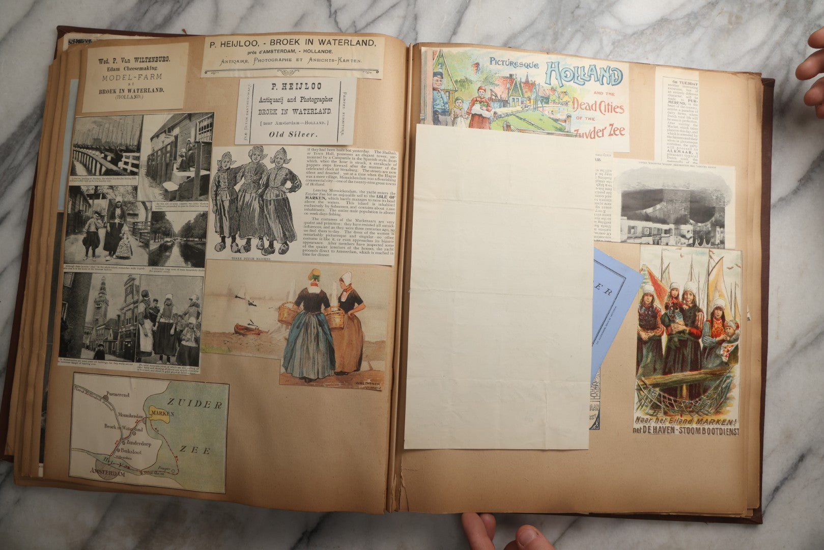Lot 082 - Antique Brown Scrapbook Album With Gold Borders, European Travel Ephemera Including Touraine, Northern Spain, Holland, Wales, Thomas Cook Tickets, Hotel Menus, Postcards, Pressed Flowers, Circa 1901