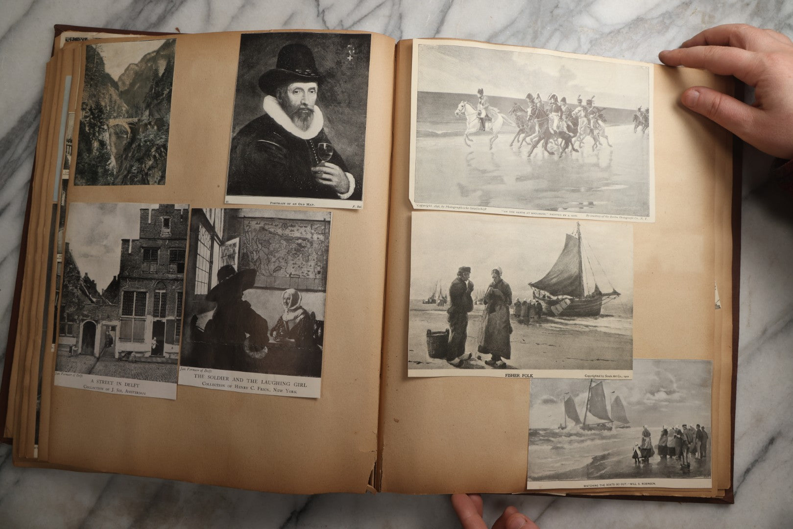 Lot 082 - Antique Brown Scrapbook Album With Gold Borders, European Travel Ephemera Including Touraine, Northern Spain, Holland, Wales, Thomas Cook Tickets, Hotel Menus, Postcards, Pressed Flowers, Circa 1901