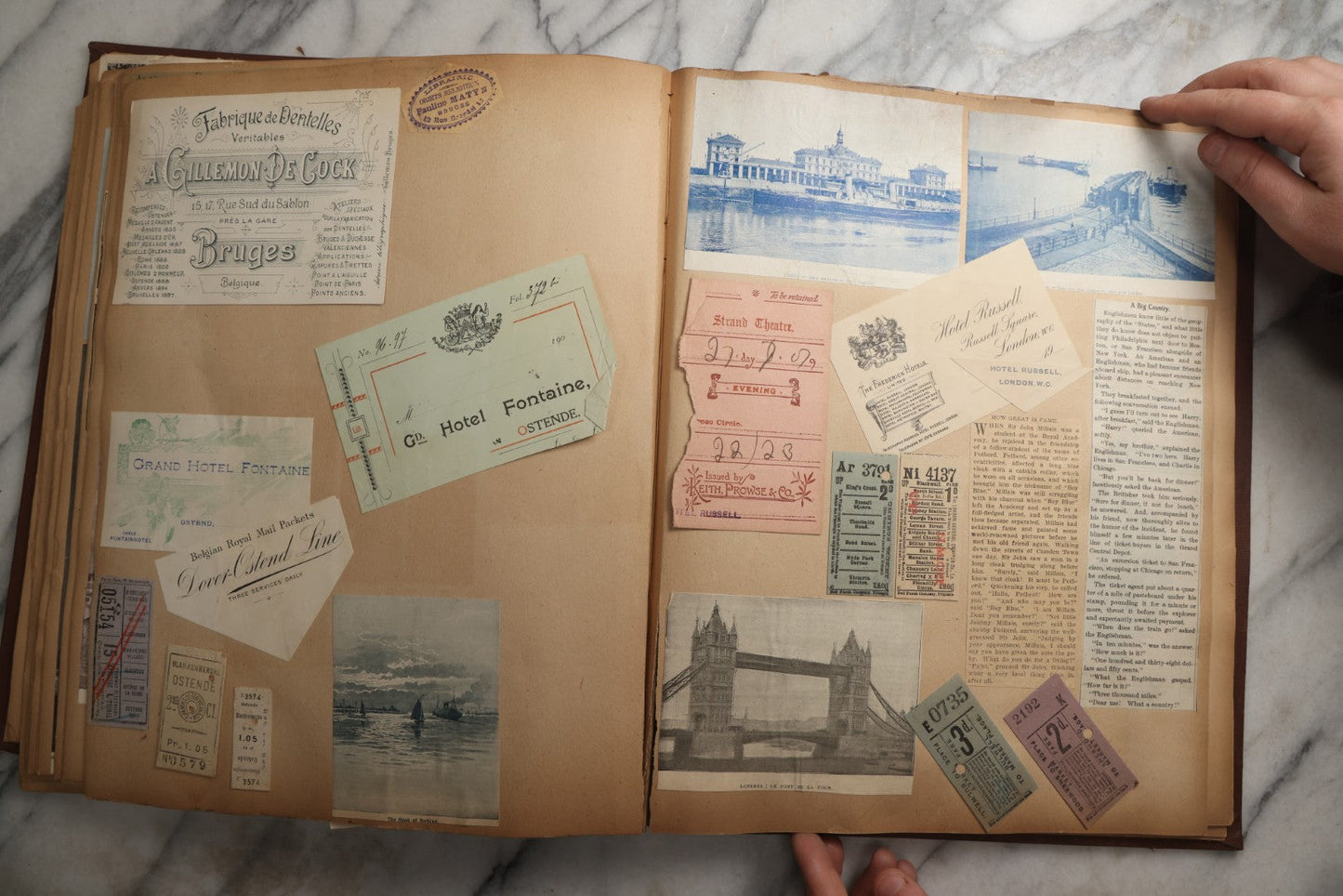 Lot 082 - Antique Brown Scrapbook Album With Gold Borders, European Travel Ephemera Including Touraine, Northern Spain, Holland, Wales, Thomas Cook Tickets, Hotel Menus, Postcards, Pressed Flowers, Circa 1901