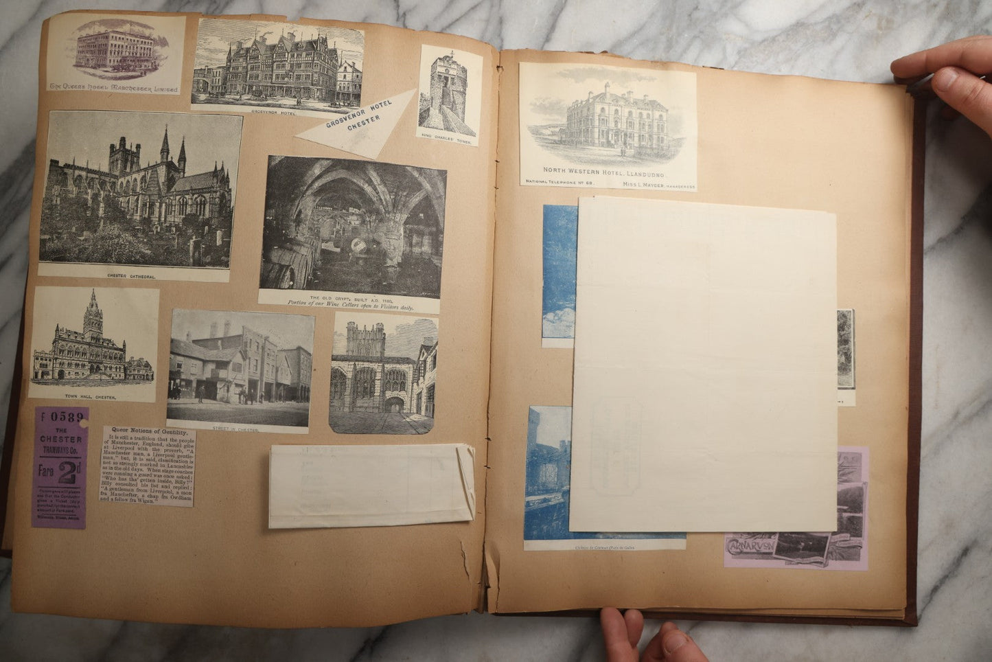 Lot 082 - Antique Brown Scrapbook Album With Gold Borders, European Travel Ephemera Including Touraine, Northern Spain, Holland, Wales, Thomas Cook Tickets, Hotel Menus, Postcards, Pressed Flowers, Circa 1901