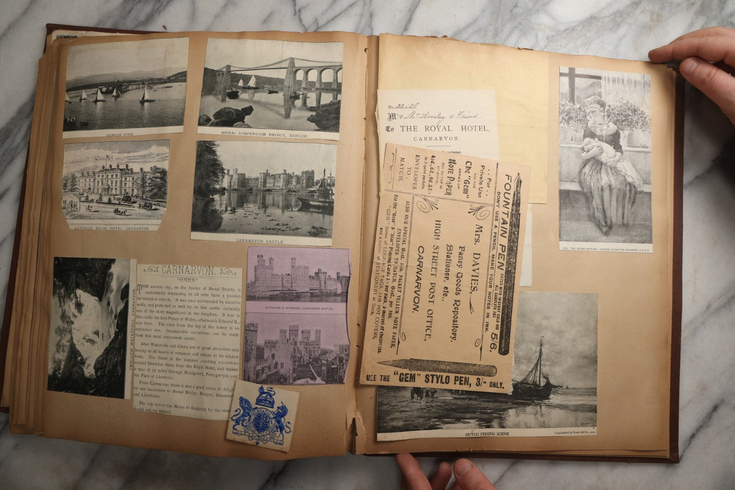 Lot 082 - Antique Brown Scrapbook Album With Gold Borders, European Travel Ephemera Including Touraine, Northern Spain, Holland, Wales, Thomas Cook Tickets, Hotel Menus, Postcards, Pressed Flowers, Circa 1901