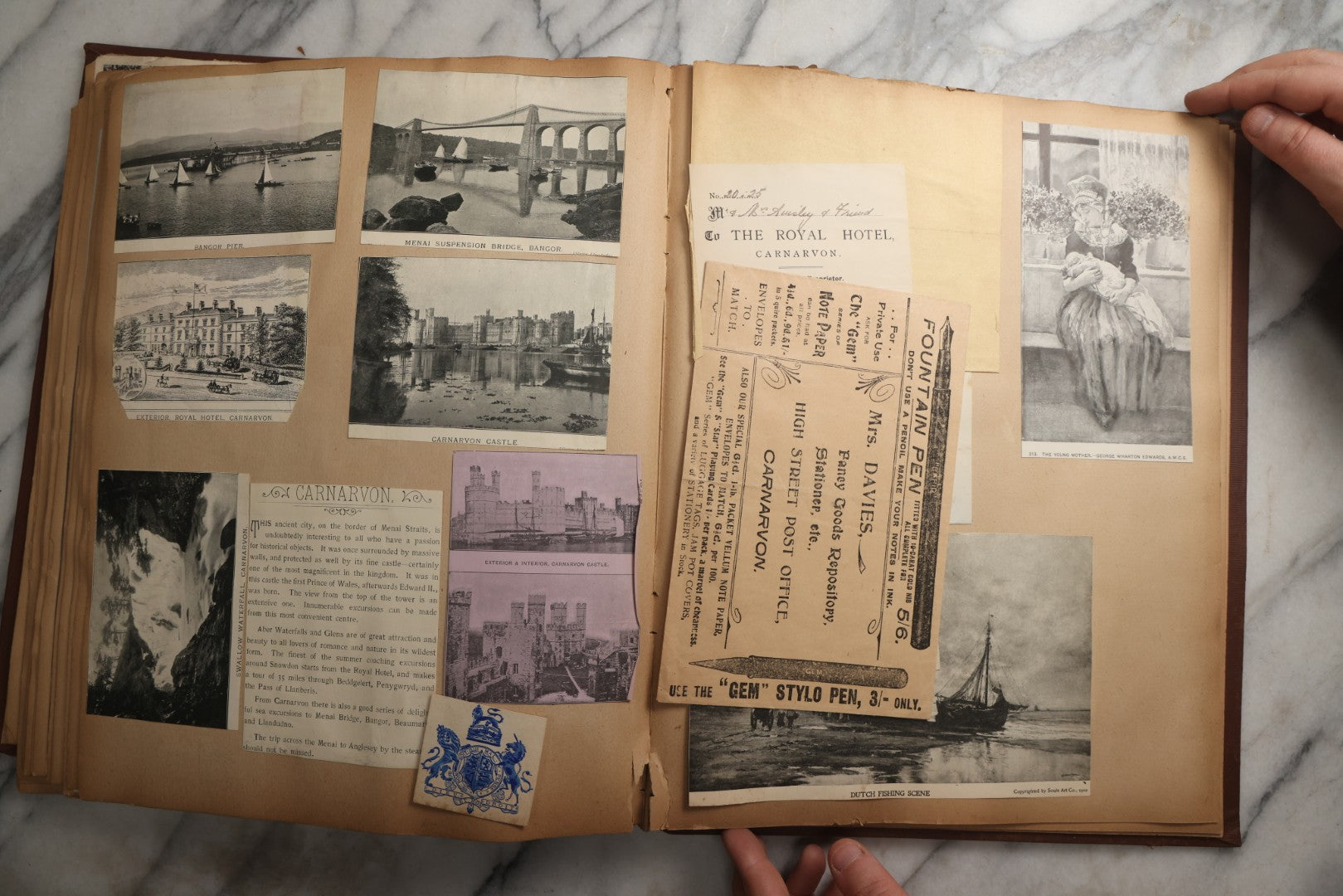 Lot 082 - Antique Brown Scrapbook Album With Gold Borders, European Travel Ephemera Including Touraine, Northern Spain, Holland, Wales, Thomas Cook Tickets, Hotel Menus, Postcards, Pressed Flowers, Circa 1901