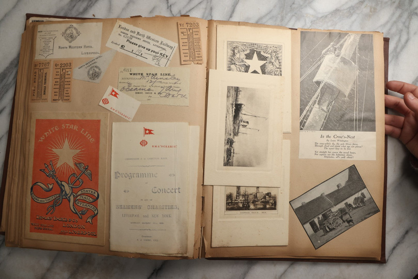 Lot 082 - Antique Brown Scrapbook Album With Gold Borders, European Travel Ephemera Including Touraine, Northern Spain, Holland, Wales, Thomas Cook Tickets, Hotel Menus, Postcards, Pressed Flowers, Circa 1901