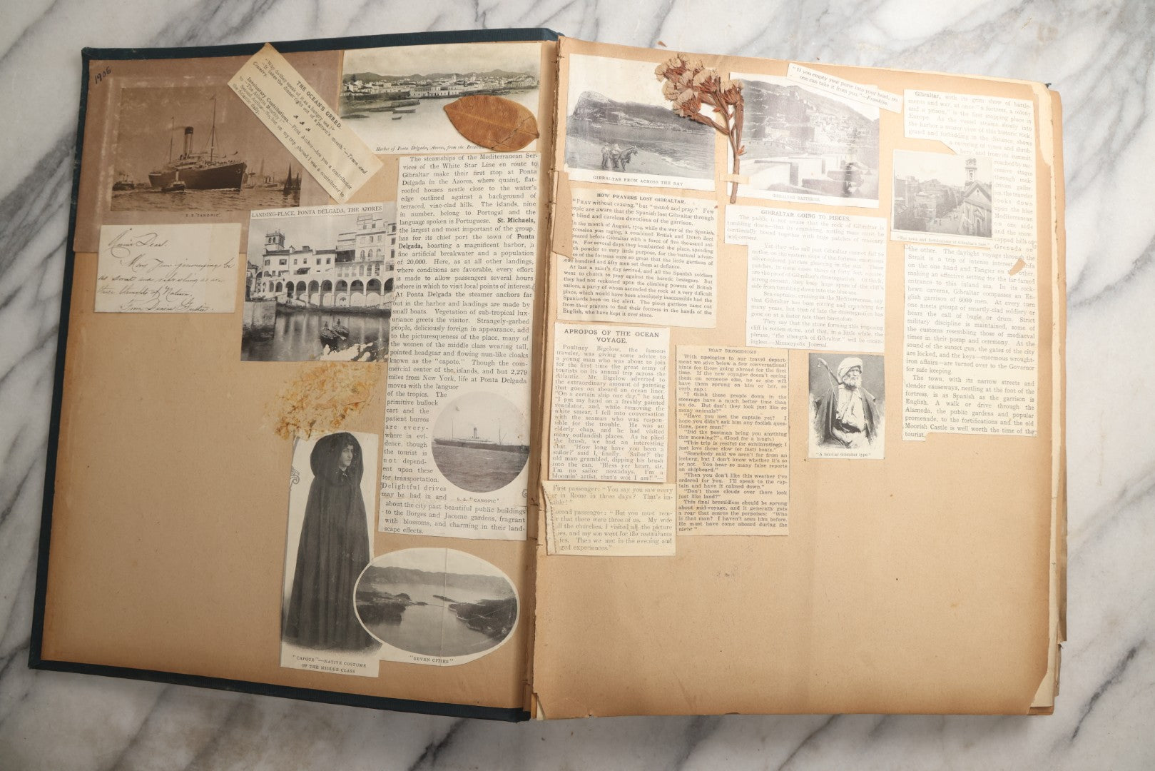 Lot 085 - Antique Blue Scrapbook Album With Gold Lettering, Gold Borders On Front Cover, Gold Lines On Spine, European Travel Ephemera Including Italy, Germany, England, Prague, Pressed Flowers Throughout, Patent March 1876, Circa 1906