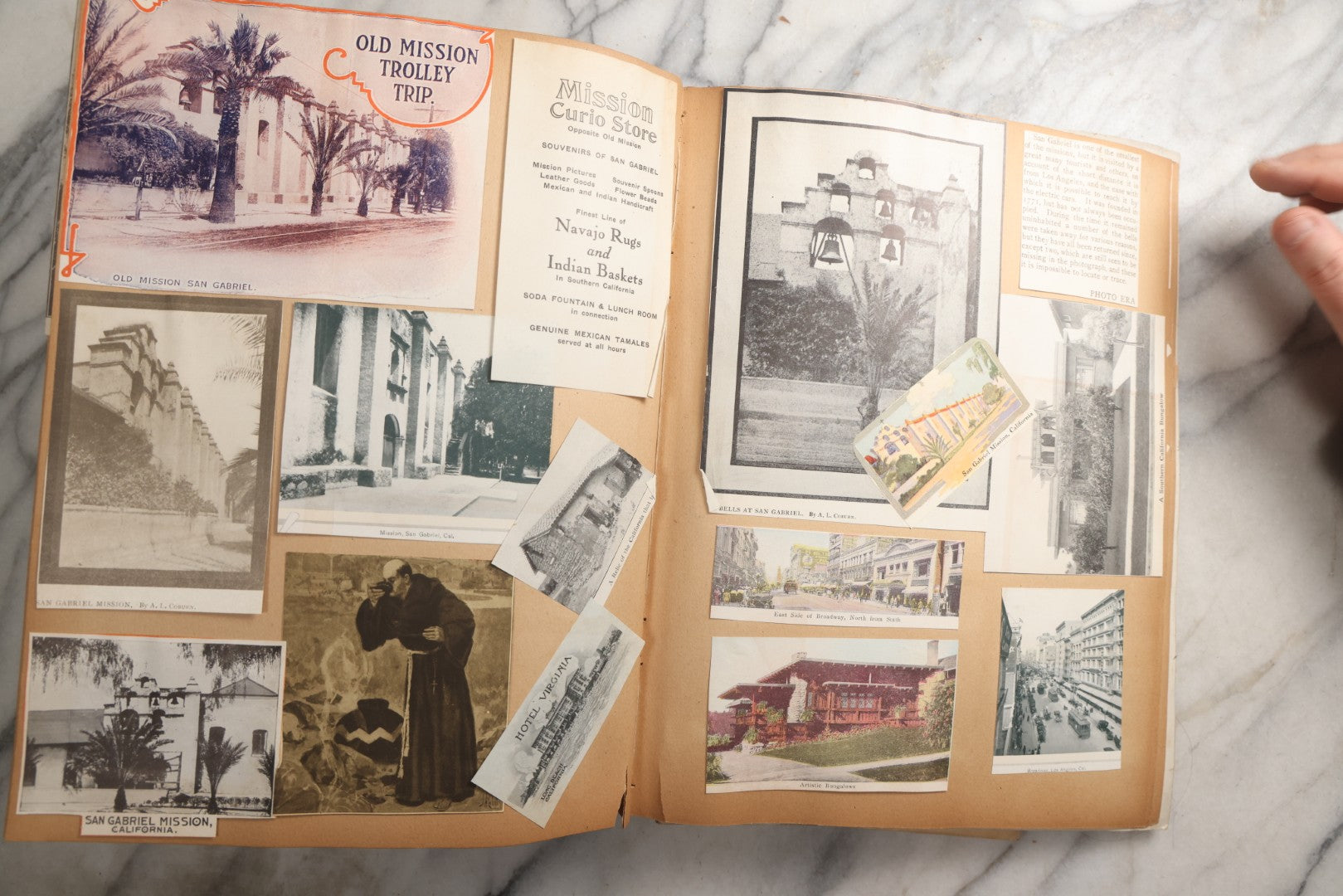 Lot 087 - Antique "The Nonpareil" Scrapbook Album With New Orleans, California, Arizona Ephemera, Pressed Flowers, 1914 Raja-Yoga Messenger Magazine, Patent March 1876, Heavy Water Staining, Warped Boards, Brittle Binding And Pages, Circa 1914