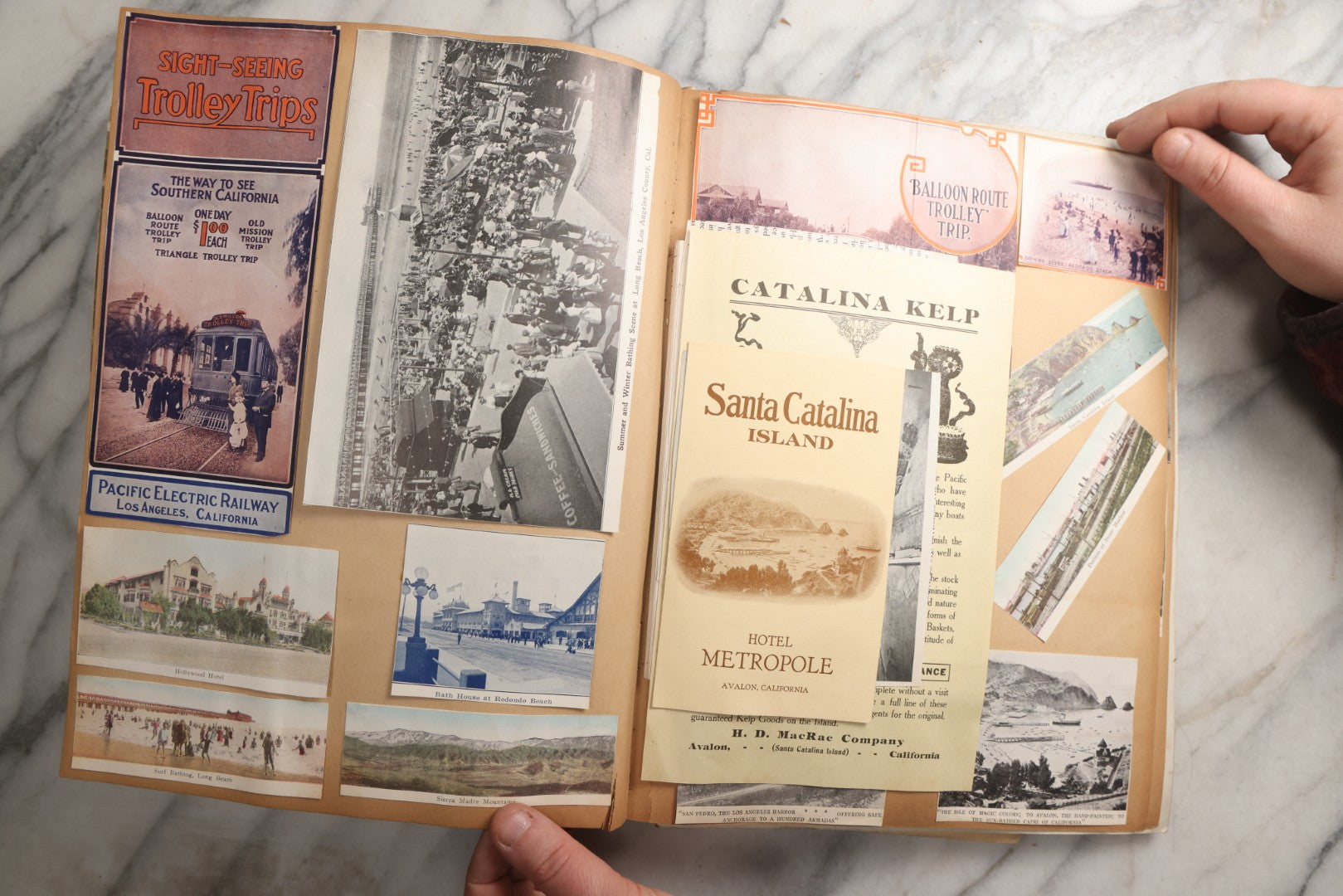 Lot 087 - Antique "The Nonpareil" Scrapbook Album With New Orleans, California, Arizona Ephemera, Pressed Flowers, 1914 Raja-Yoga Messenger Magazine, Patent March 1876, Heavy Water Staining, Warped Boards, Brittle Binding And Pages, Circa 1914