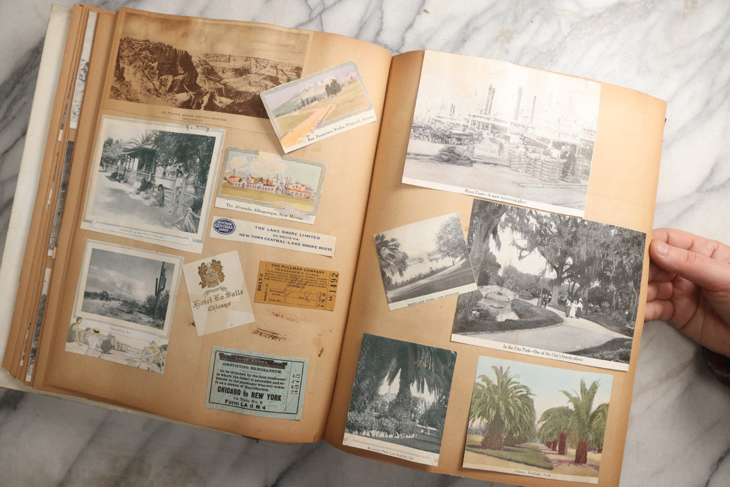 Lot 087 - Antique "The Nonpareil" Scrapbook Album With New Orleans, California, Arizona Ephemera, Pressed Flowers, 1914 Raja-Yoga Messenger Magazine, Patent March 1876, Heavy Water Staining, Warped Boards, Brittle Binding And Pages, Circa 1914