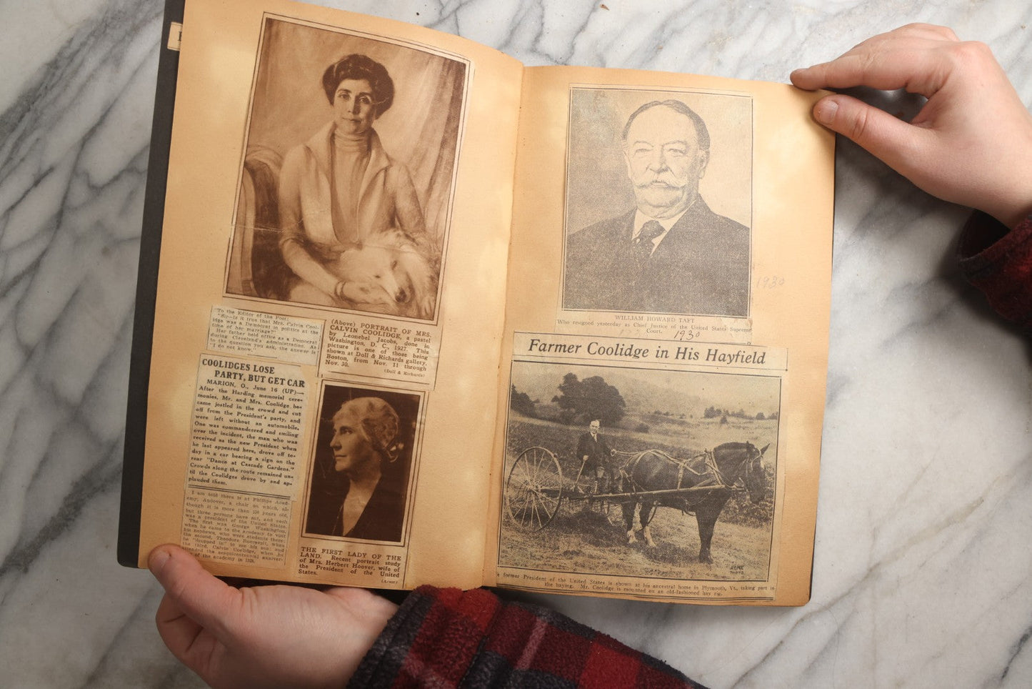 Lot 088 - Vintage Paperboard Scrapbook Album With Embossed Windmill Design, Politicians, Royalty, Popular Science, Events, And Lindbergh Family Newspaper Clippings, Circa 1930s