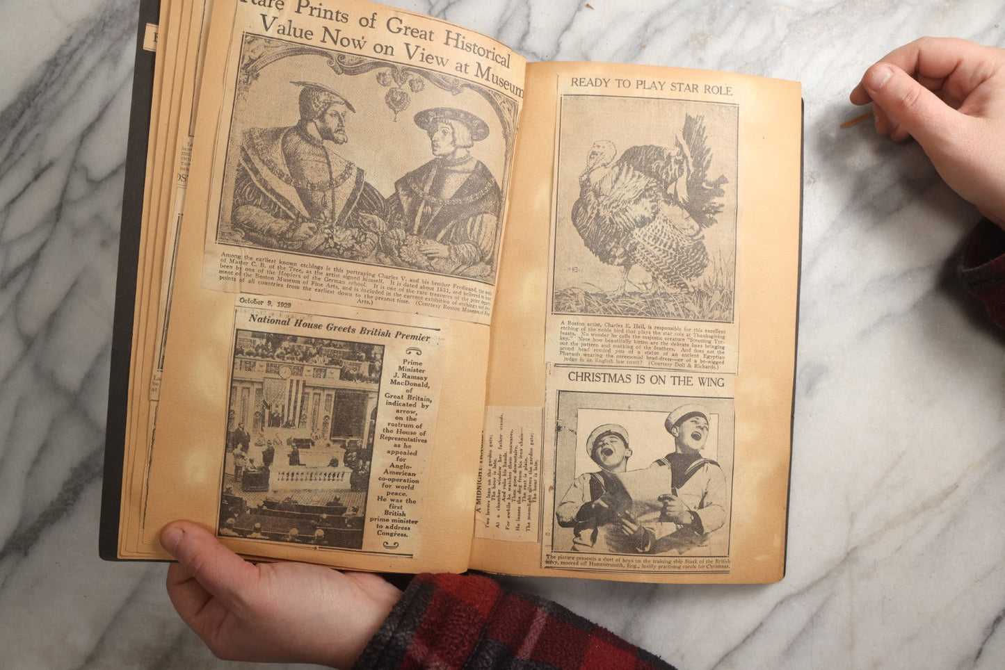 Lot 088 - Vintage Paperboard Scrapbook Album With Embossed Windmill Design, Politicians, Royalty, Popular Science, Events, And Lindbergh Family Newspaper Clippings, Circa 1930s