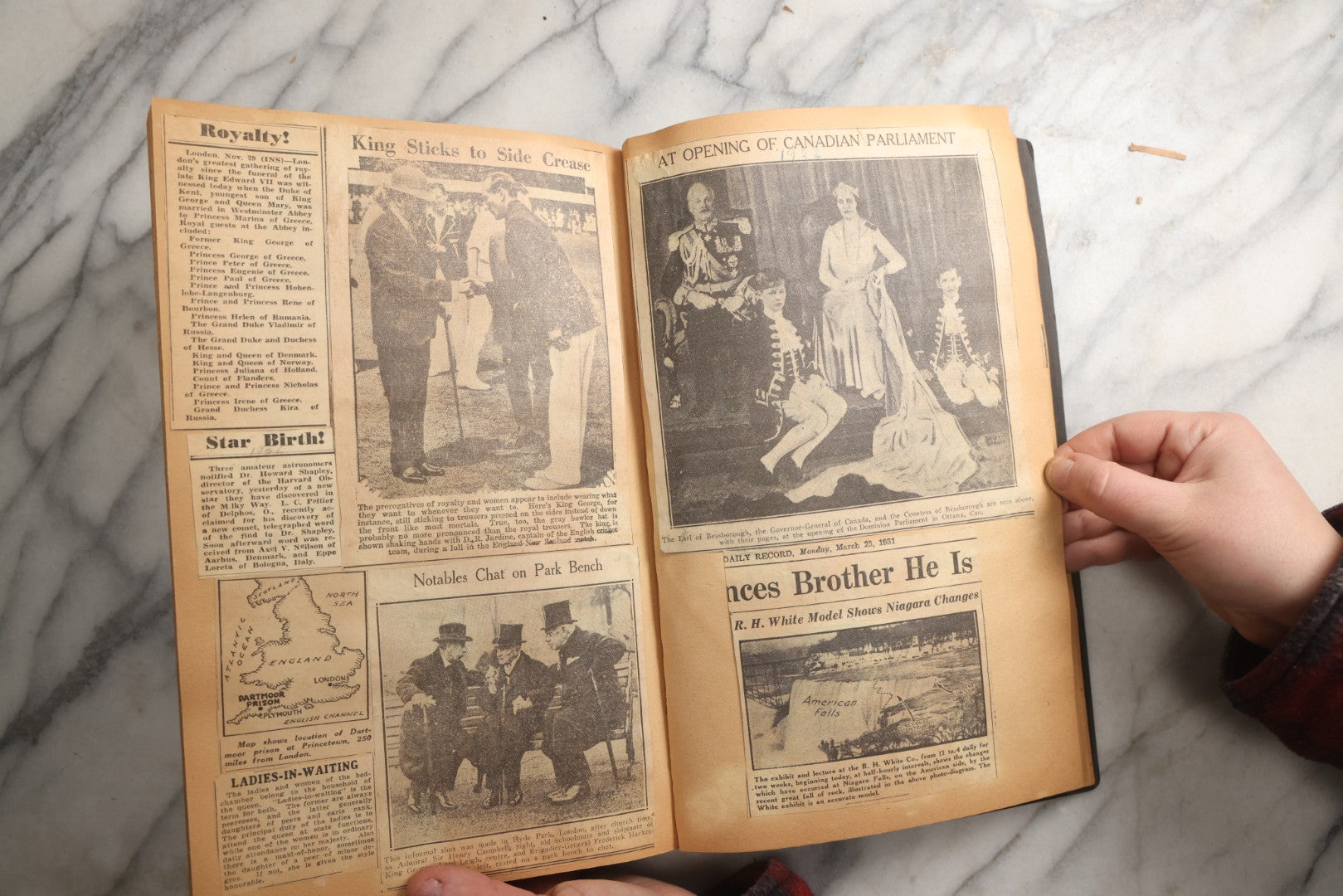 Lot 088 - Vintage Paperboard Scrapbook Album With Embossed Windmill Design, Politicians, Royalty, Popular Science, Events, And Lindbergh Family Newspaper Clippings, Circa 1930s