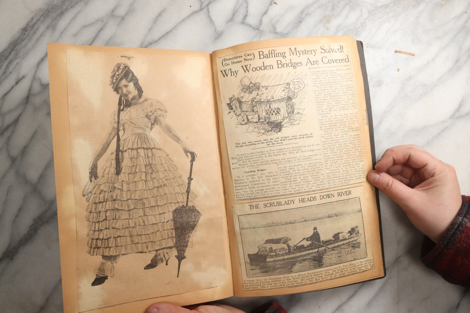 Lot 088 - Vintage Paperboard Scrapbook Album With Embossed Windmill Design, Politicians, Royalty, Popular Science, Events, And Lindbergh Family Newspaper Clippings, Circa 1930s