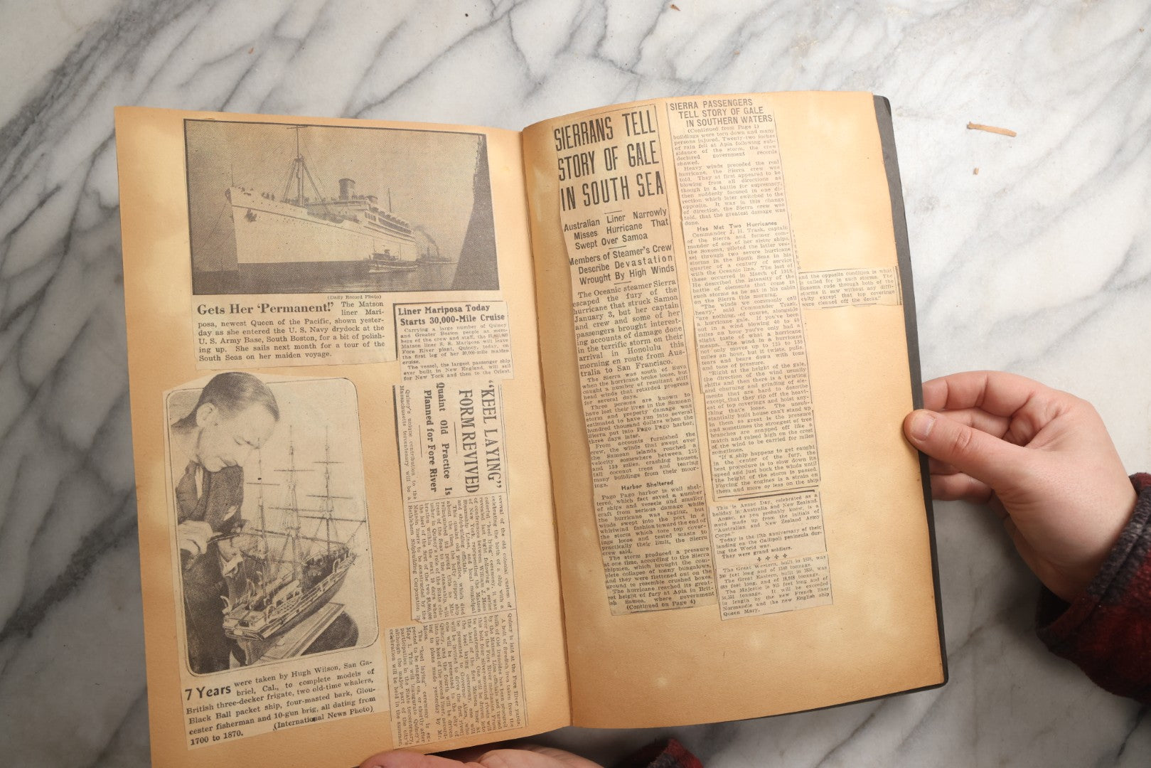 Lot 088 - Vintage Paperboard Scrapbook Album With Embossed Windmill Design, Politicians, Royalty, Popular Science, Events, And Lindbergh Family Newspaper Clippings, Circa 1930s