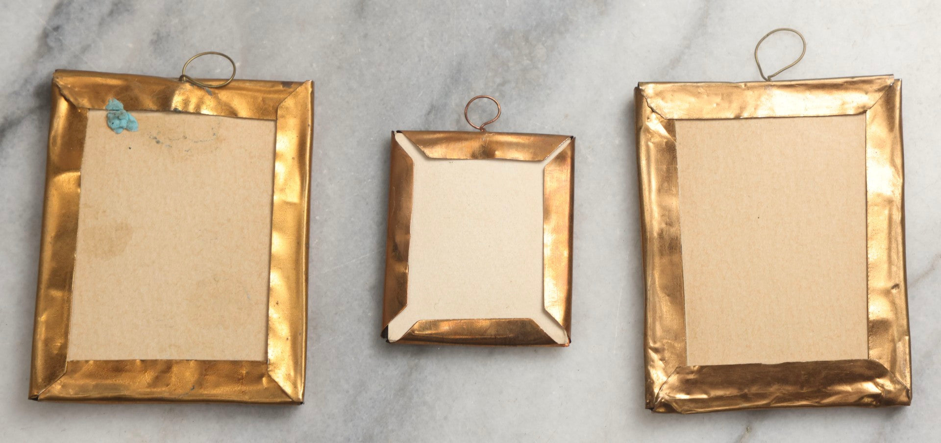 Lot 098 - Trio Of Antique Miniature Die-Cut Chromolithograph Scrap Figures In 1/9th And 1/16th Plate Photo Frames, Including Girl With Muff & Boy With Scythe, Boy With Sword, And Girl In Yellow Dress, All With Backing And Wire Loops