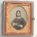 Lot 101 - Antique 1/9th Plate Ambrotype Photograph Of Teenage Girl Holding Object, Identified As Hattie A. Ellis, October 1862, Age 18, In Half Leatherette Union Case, With Geo. W. Clarke Studio Card, Boston, Massachusetts