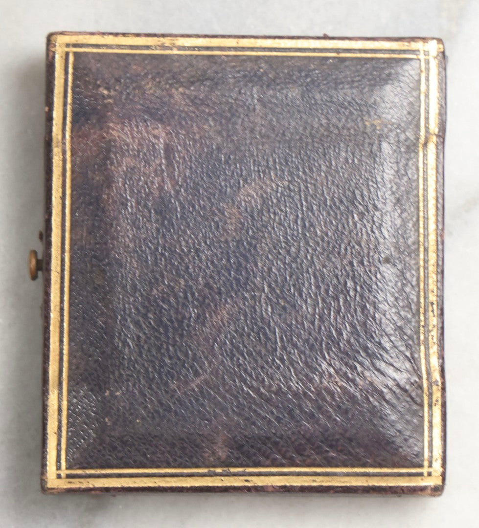 Lot 101 - Antique 1/9th Plate Ambrotype Photograph Of Teenage Girl Holding Object, Identified As Hattie A. Ellis, October 1862, Age 18, In Half Leatherette Union Case, With Geo. W. Clarke Studio Card, Boston, Massachusetts