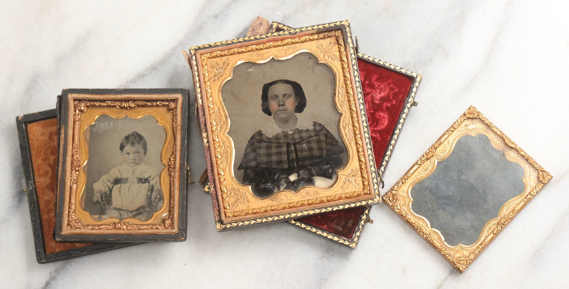 Lot 102 - Trio Of Antique Photographs Including 1/6th Plate Ruby Ambrotype Of Woman With Rosy Cheeks In Full Split Leatherette Case, 1/9th Plate Tintype Of Boy In Split Leatherette Case, And 1/9th Plate Tintype Of Woman With Mat And Preserver, No Case