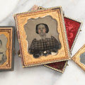 Lot 102 - Trio Of Antique Photographs Including 1/6th Plate Ruby Ambrotype Of Woman With Rosy Cheeks In Full Split Leatherette Case, 1/9th Plate Tintype Of Boy In Split Leatherette Case, And 1/9th Plate Tintype Of Woman With Mat And Preserver, No Case