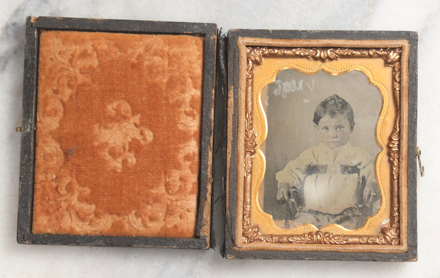 Lot 102 - Trio Of Antique Photographs Including 1/6th Plate Ruby Ambrotype Of Woman With Rosy Cheeks In Full Split Leatherette Case, 1/9th Plate Tintype Of Boy In Split Leatherette Case, And 1/9th Plate Tintype Of Woman With Mat And Preserver, No Case