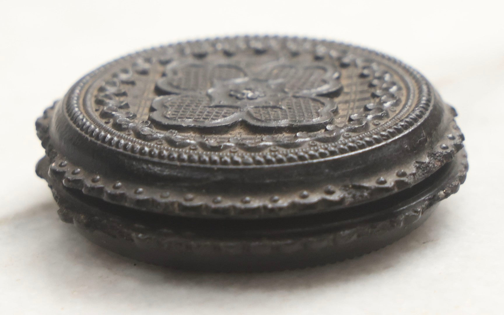 Lot 103 - Pair Of Antique Photographs Including Tintype Of Baby In Thermoplastic Screw-Top “Oreo” Case And Trimmed Carte De Visite C.D.V.. Of Boy In Brass Brooch Frame, Brooch Missing Pin On Back