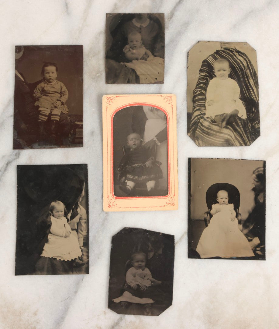 Lot 106 - Grouping Of Seven Antique “Not-So-Hidden Mother” Tintype Photographs Of Children With Mothers Or Assistants Conspicuously Visible In Shot, Including Examples With Striped Covering, Dark Curtain, Motion Blur, And More