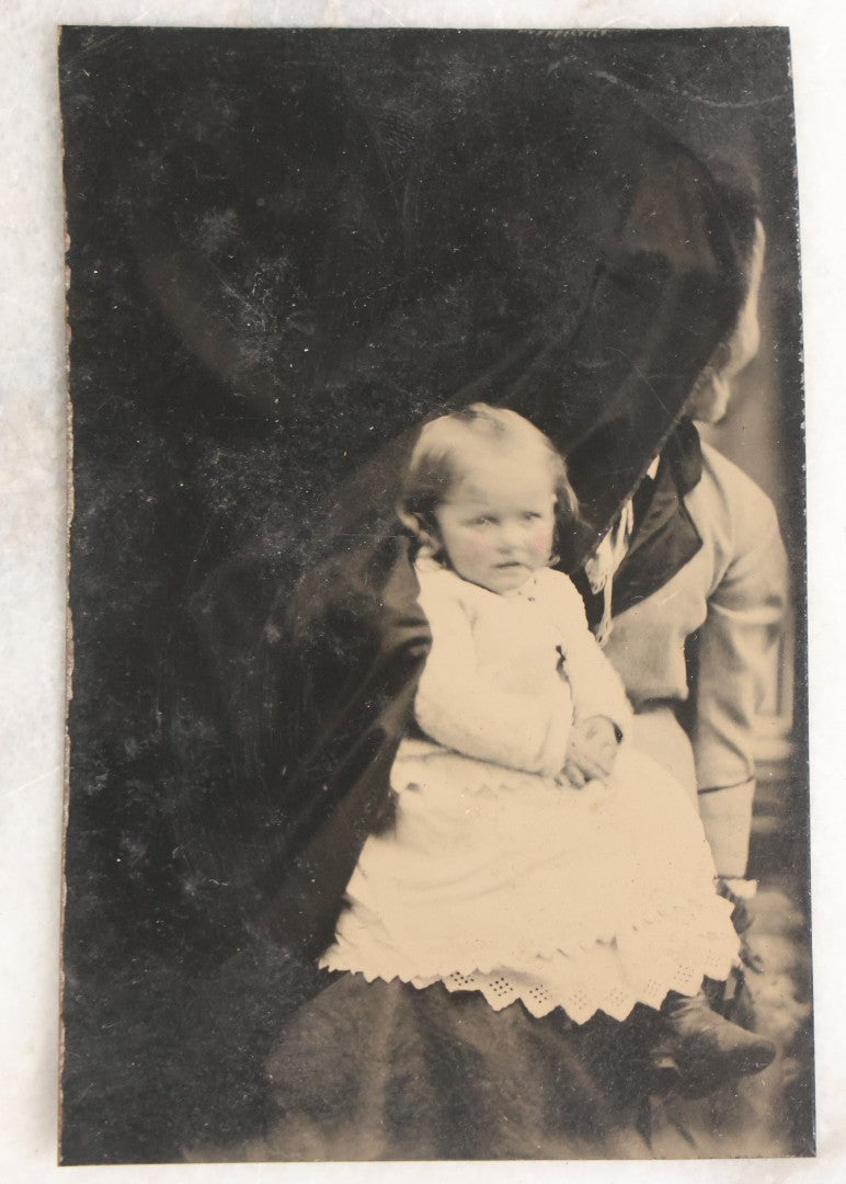 Lot 106 - Grouping Of Seven Antique “Not-So-Hidden Mother” Tintype Photographs Of Children With Mothers Or Assistants Conspicuously Visible In Shot, Including Examples With Striped Covering, Dark Curtain, Motion Blur, And More
