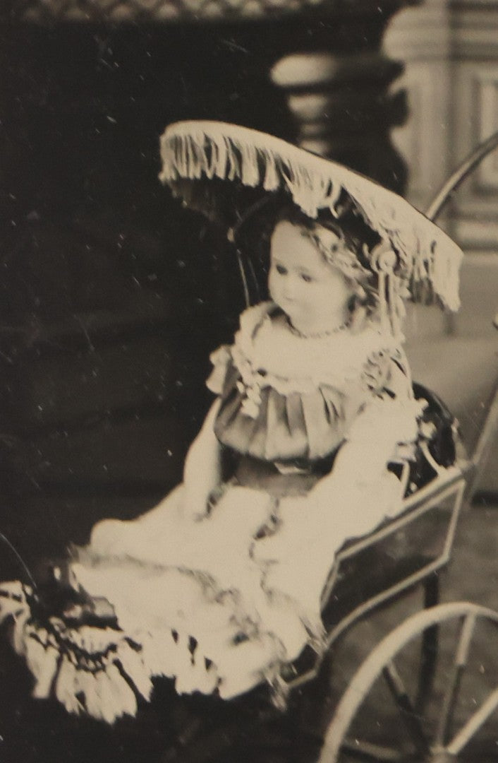 Lot 107 - Antique Tintype Photograph Of Curly-Haired Girl Standing Beside Pram With Large Toy Doll