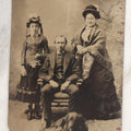 Lot 110 - Antique Near Half Plate Tintype Photograph Of Family Group With Mother, Father, Daughter, And Blurry Black Dog Seated At Their Feet, In Black Paper Frame