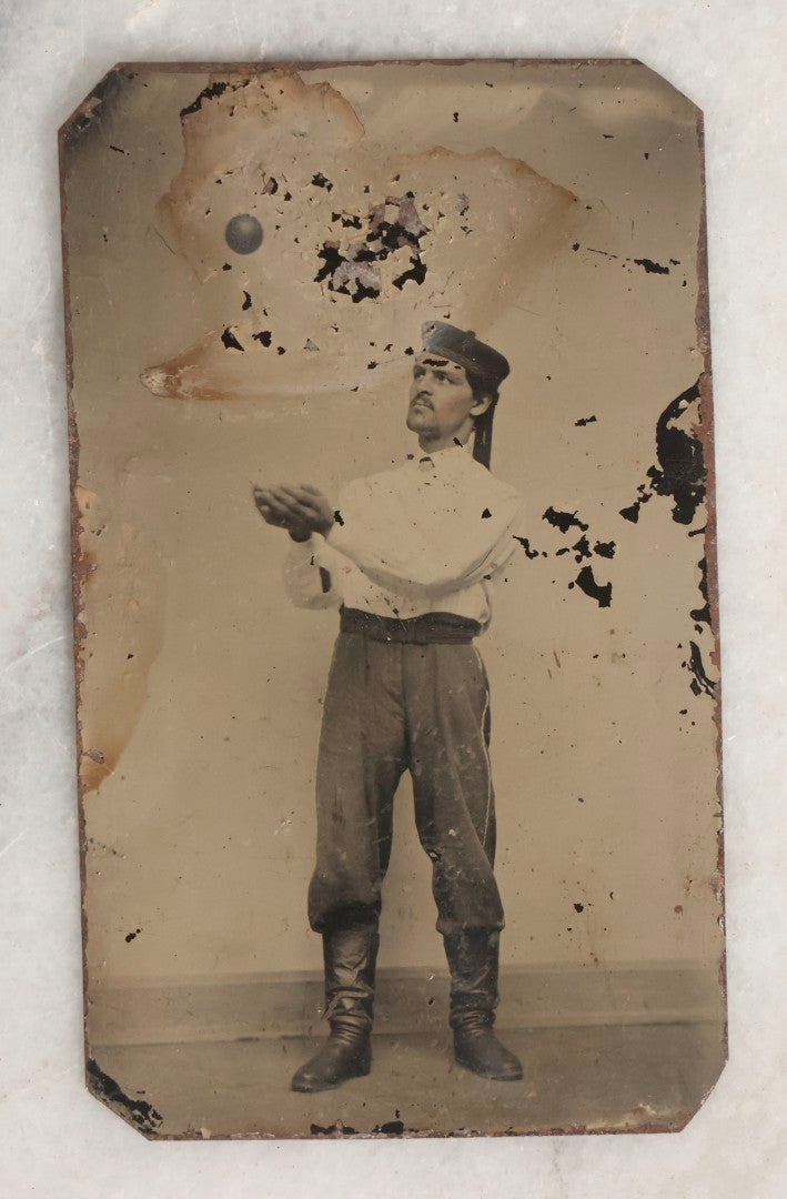 Lot 116 - Antique Tintype Photograph Of Male Performer With Ball Suspended Above Outstretched Hands, Likely Supported By Hidden String To Create Illusion
