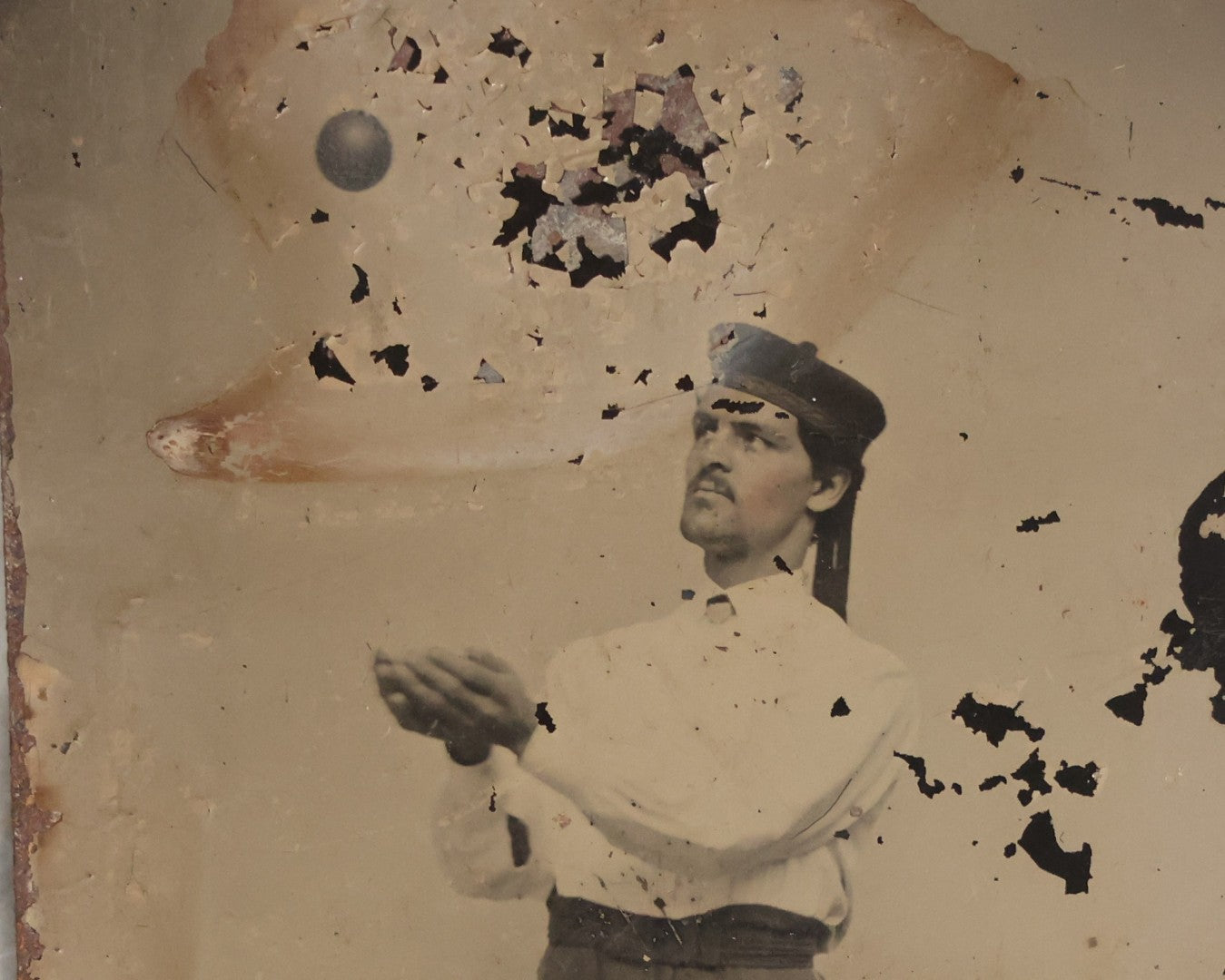 Lot 116 - Antique Tintype Photograph Of Male Performer With Ball Suspended Above Outstretched Hands, Likely Supported By Hidden String To Create Illusion