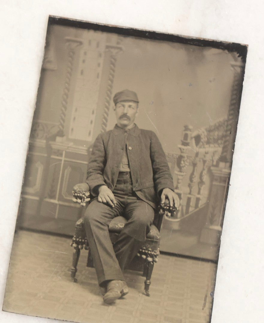 Lot 119 - Grouping Of 18 Antique Tintype Photographs Including Multiple Portraits Of Gruff Mustached Man In Cap, Woman Holding Book, Annoyed Teenage Girl In Small Hat, Family Of Five, Very Old Bearded Man, And Handsome Young Man In Cap