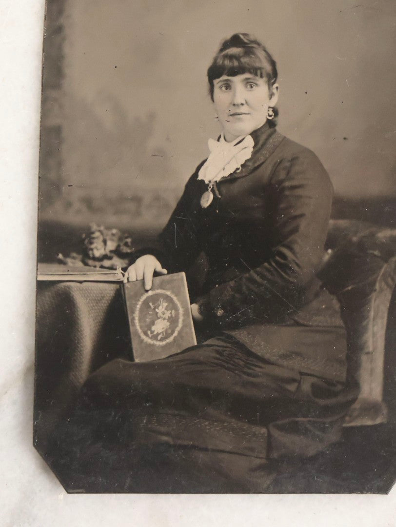 Lot 119 - Grouping Of 18 Antique Tintype Photographs Including Multiple Portraits Of Gruff Mustached Man In Cap, Woman Holding Book, Annoyed Teenage Girl In Small Hat, Family Of Five, Very Old Bearded Man, And Handsome Young Man In Cap