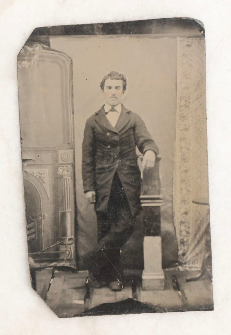 Lot 119 - Grouping Of 18 Antique Tintype Photographs Including Multiple Portraits Of Gruff Mustached Man In Cap, Woman Holding Book, Annoyed Teenage Girl In Small Hat, Family Of Five, Very Old Bearded Man, And Handsome Young Man In Cap