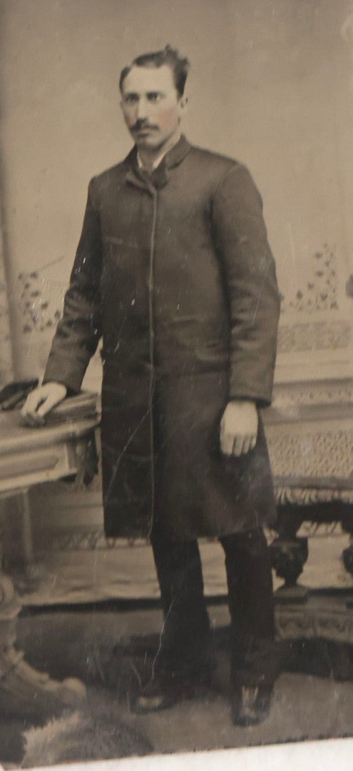 Lot 119 - Grouping Of 18 Antique Tintype Photographs Including Multiple Portraits Of Gruff Mustached Man In Cap, Woman Holding Book, Annoyed Teenage Girl In Small Hat, Family Of Five, Very Old Bearded Man, And Handsome Young Man In Cap
