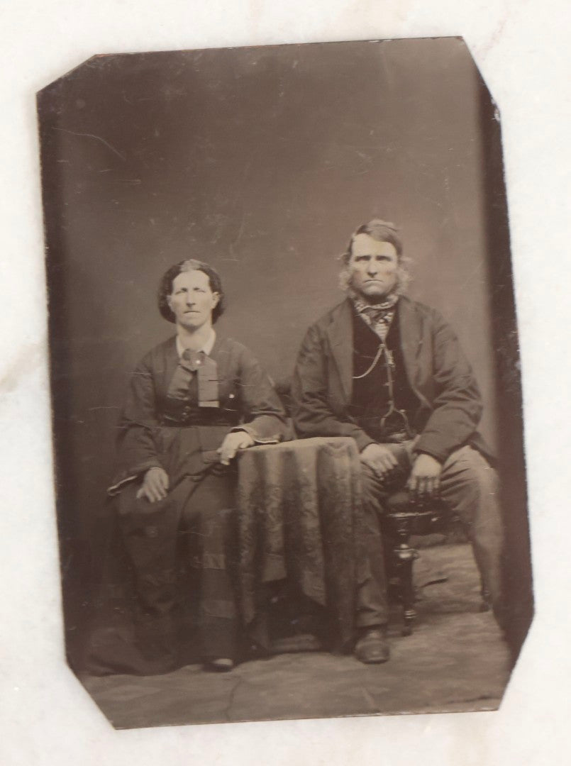 Lot 119 - Grouping Of 18 Antique Tintype Photographs Including Multiple Portraits Of Gruff Mustached Man In Cap, Woman Holding Book, Annoyed Teenage Girl In Small Hat, Family Of Five, Very Old Bearded Man, And Handsome Young Man In Cap