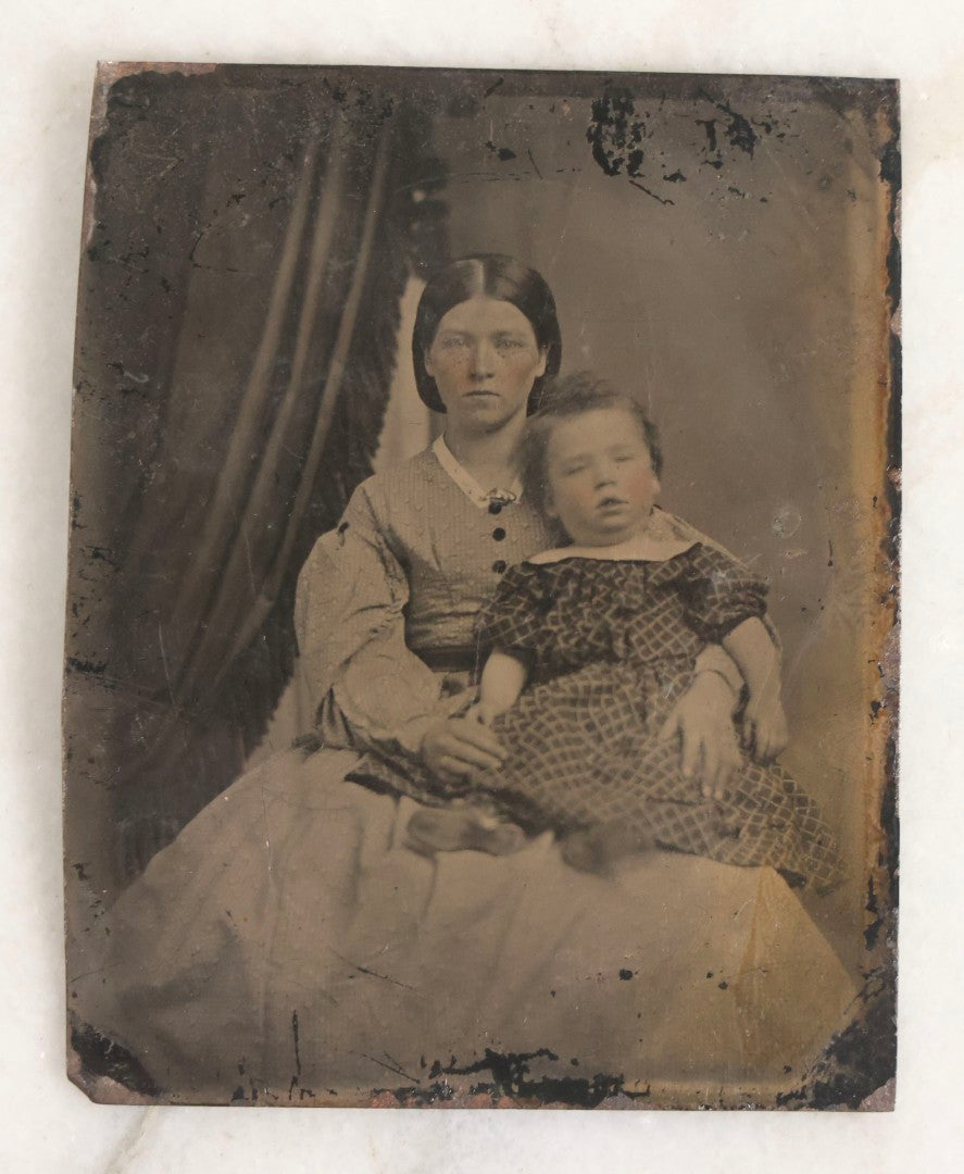 Lot 119 - Grouping Of 18 Antique Tintype Photographs Including Multiple Portraits Of Gruff Mustached Man In Cap, Woman Holding Book, Annoyed Teenage Girl In Small Hat, Family Of Five, Very Old Bearded Man, And Handsome Young Man In Cap