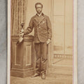 Lot 123 - Antique Carte De Visite C.D.V.. Photograph Of Black Man In Double-Breasted Jacket With Cap In Hand, Photographed By George West, Gosport, England, With Maritime-Themed Backdrop