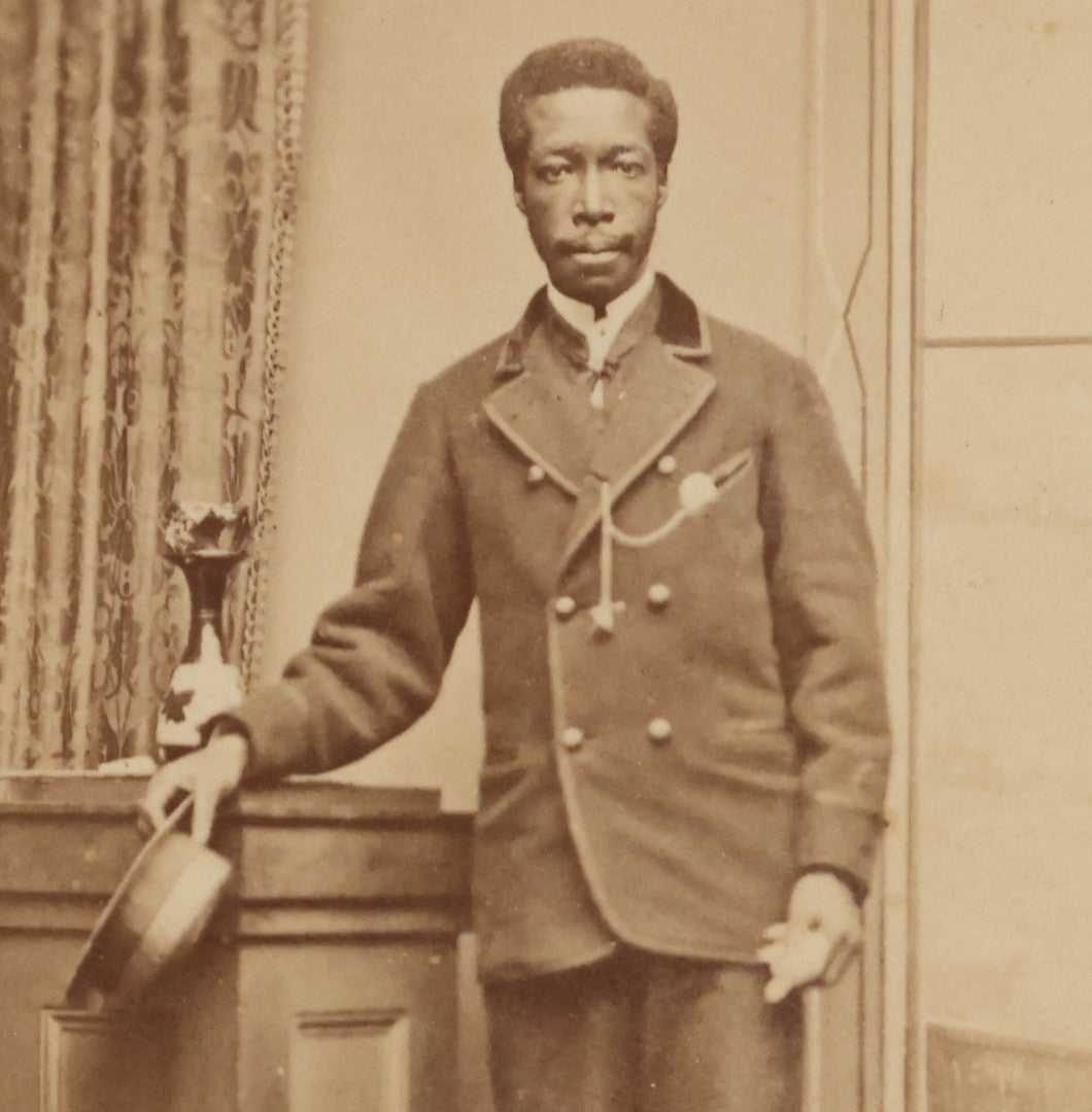 Lot 123 - Antique Carte De Visite C.D.V.. Photograph Of Black Man In Double-Breasted Jacket With Cap In Hand, Photographed By George West, Gosport, England, With Maritime-Themed Backdrop